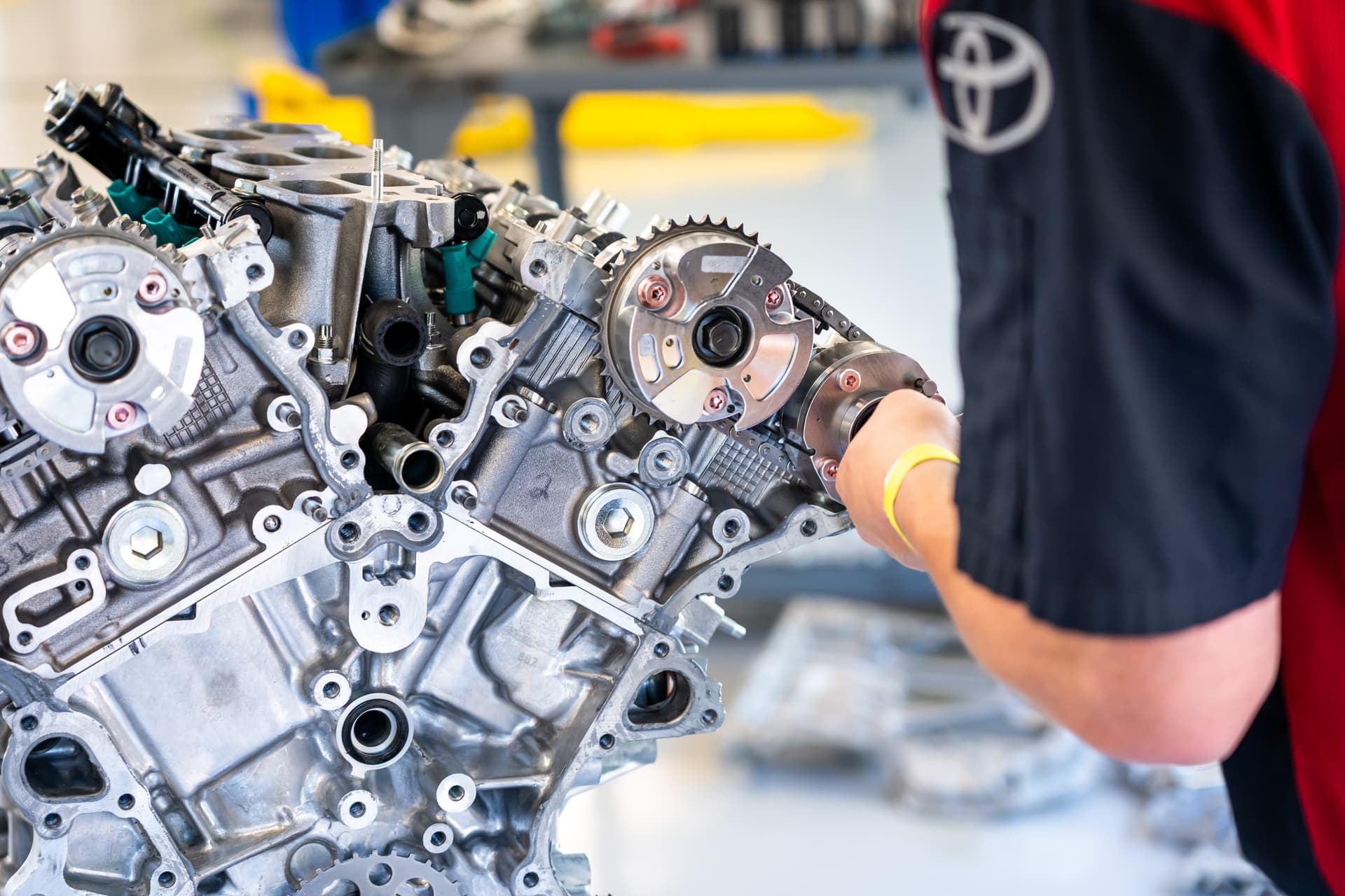 Student performing engine repair