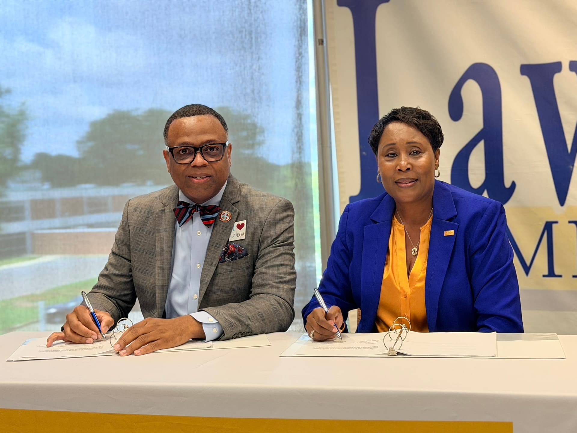 Dr. Cynthia T. Anthony and Dr. Willie J. Todd, Jr. at the transfer agreement signing