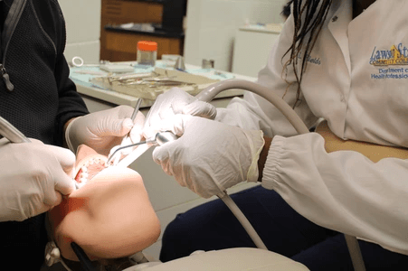 Dental assisting student in a clinical training exercise