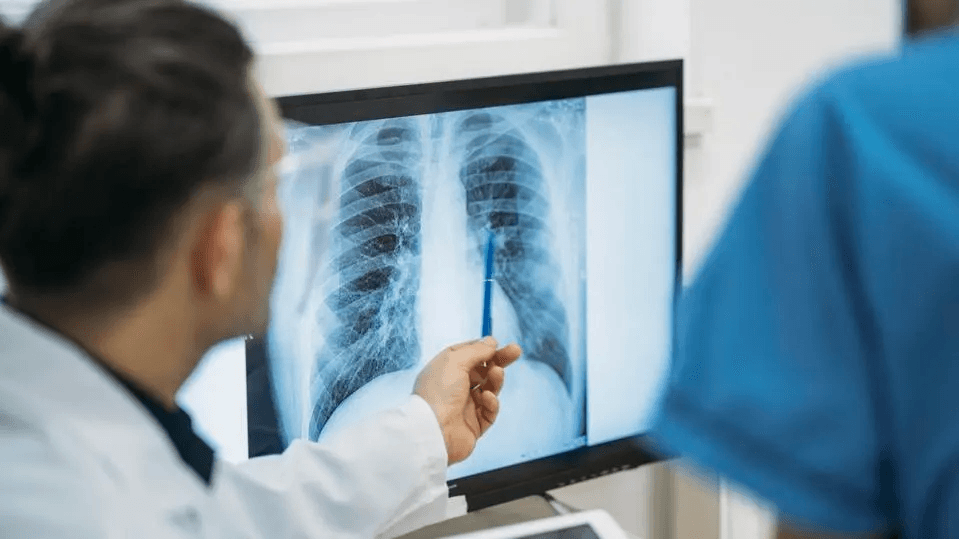 Radiologic technology students reviewing a chest X-ray