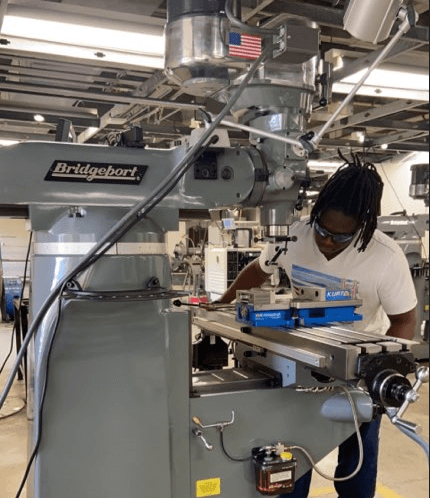 Machine Tool Technology student operating a mill